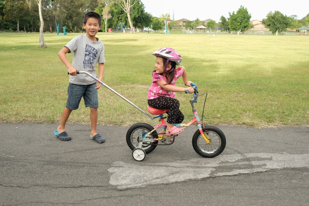 Bicycle training outlet handle