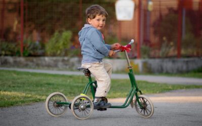 What is the youngest age a kid can start riding a tricycle?